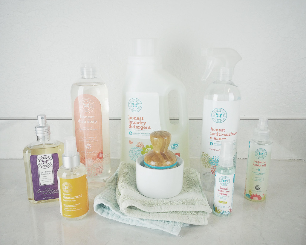 Variety of Honest Company cleaning products sitting on kitchen countertop