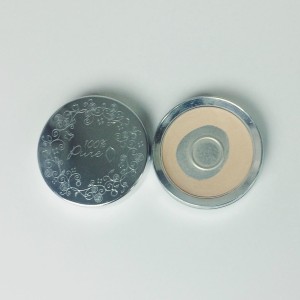 Silver compact with 100 percent pure pressed powder foundation in shade creme