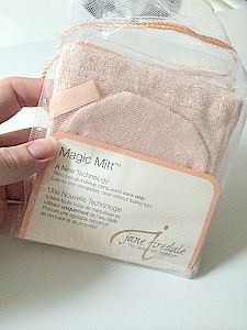 Jane Iredale pink magic mitt in woman's hands