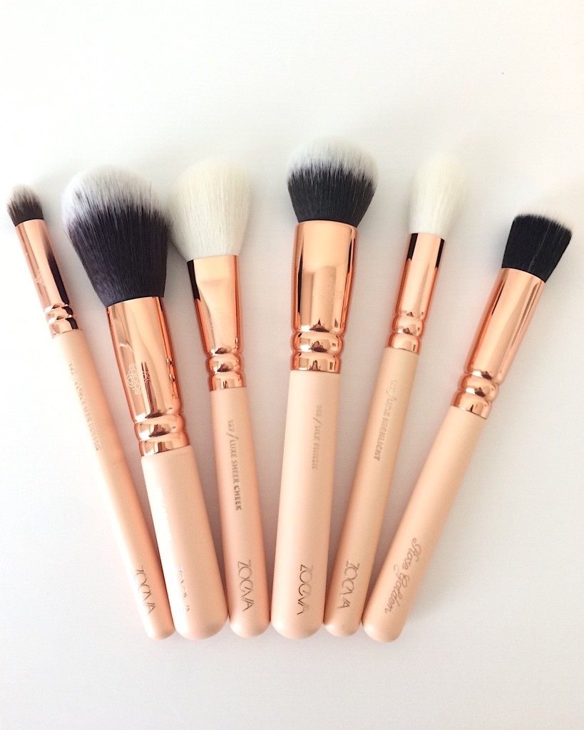 Zoeva rose gold and nude makeup brushes layed out