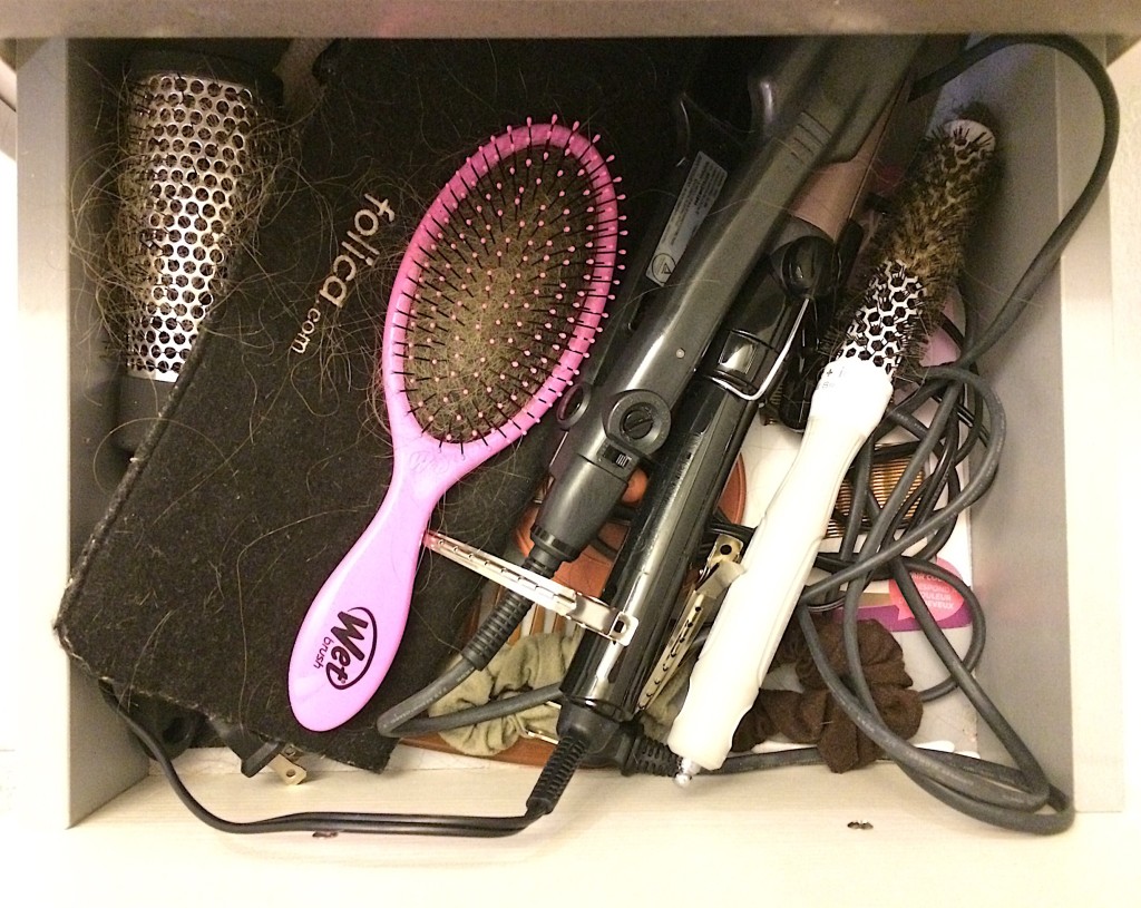Before shot of cluttered bathroom drawer