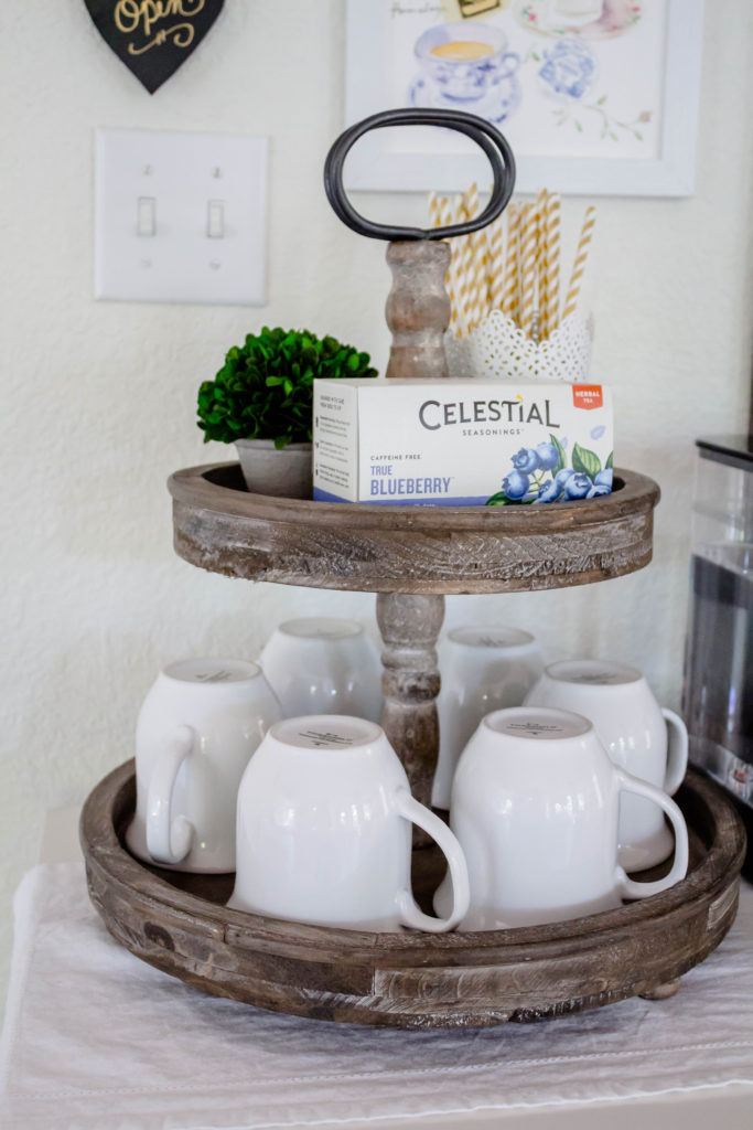 tiered tray with tea straws and white coffee cups